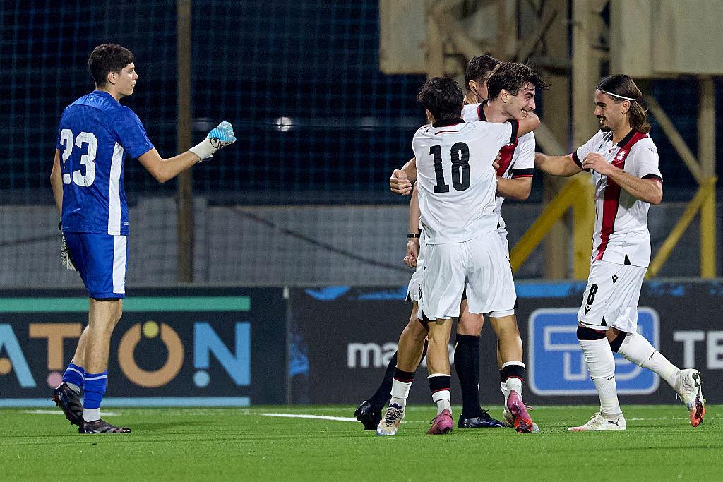 Saba Kharebashvili of Georgia reacts in celebration with teammates Gurami Japaridze and Irakli Egoyan after scoring the 0-1 goal during the UEFA European Under-21 Championship 2027 Qualifying round soccer match between Malta and Georgia at the Centenary Stadium in Ta' Qali, Malta, on October 14, 2025.