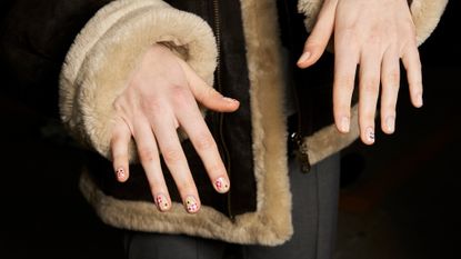 woman with yellow nails