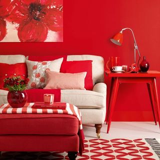 red living room with sofa and table