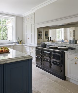 kitchen with blue kitchen island and aga