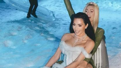 Kim Kardashian and BFF Paris Hilton shimmer in new Christas Eve party photos.