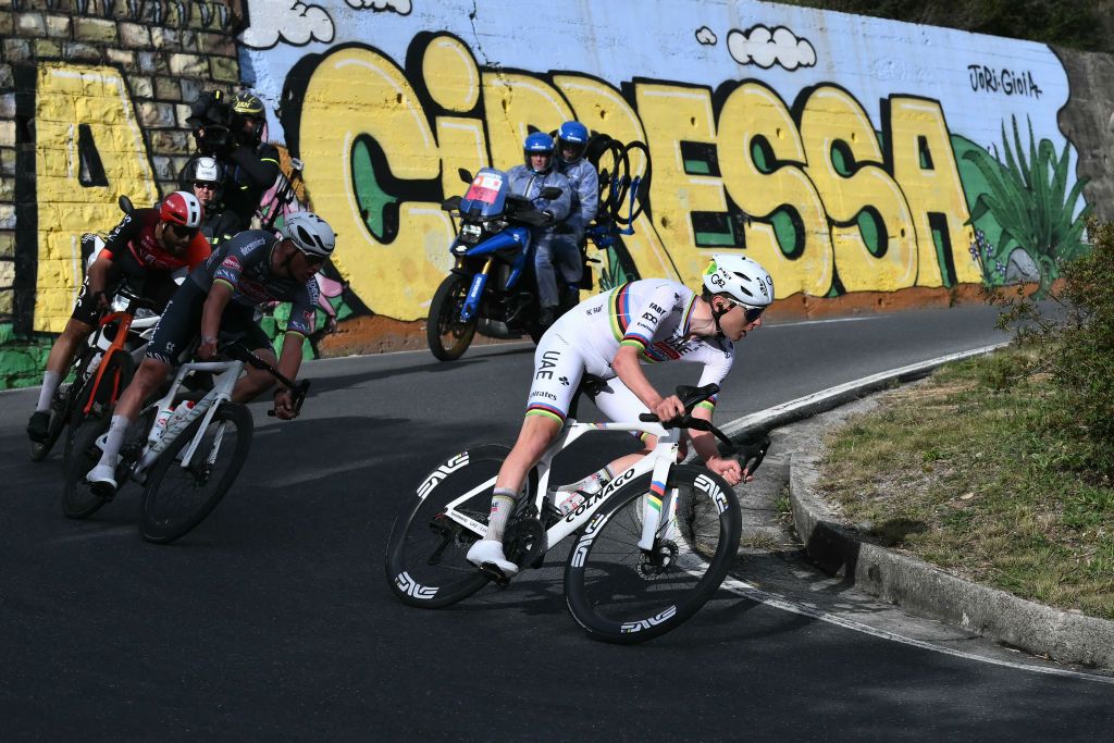 Team UAE's Slovenian rider Tadej Pogacar rides la Cipressa downhill during the Milan - Sanremo one-day classic cycling race, on March 22, 2025. (Photo by Marco BERTORELLO / AFP)
