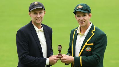 England captain Joe Root and Australia skipper Tim Paine hold the urn ahead of the Ashes 