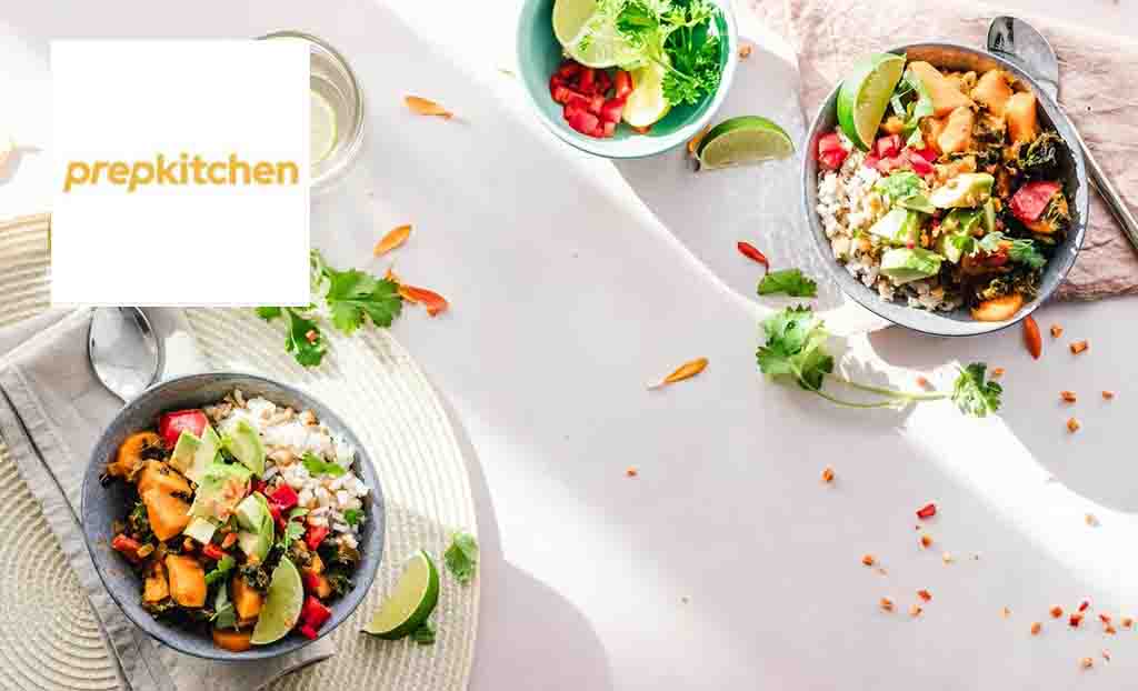 prepkitchen logo top left with two bowls of salad on the table 