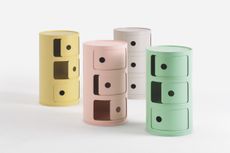 Kartell ‘Componibili’ storage. Round chest of drawers with three drawers on each in yellow, pink, purple and green.