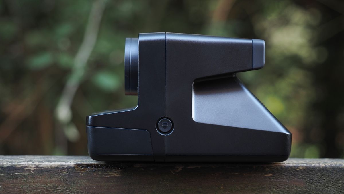Polaroid Now+ Generation 2 on a wooden surface, in a woodland setting