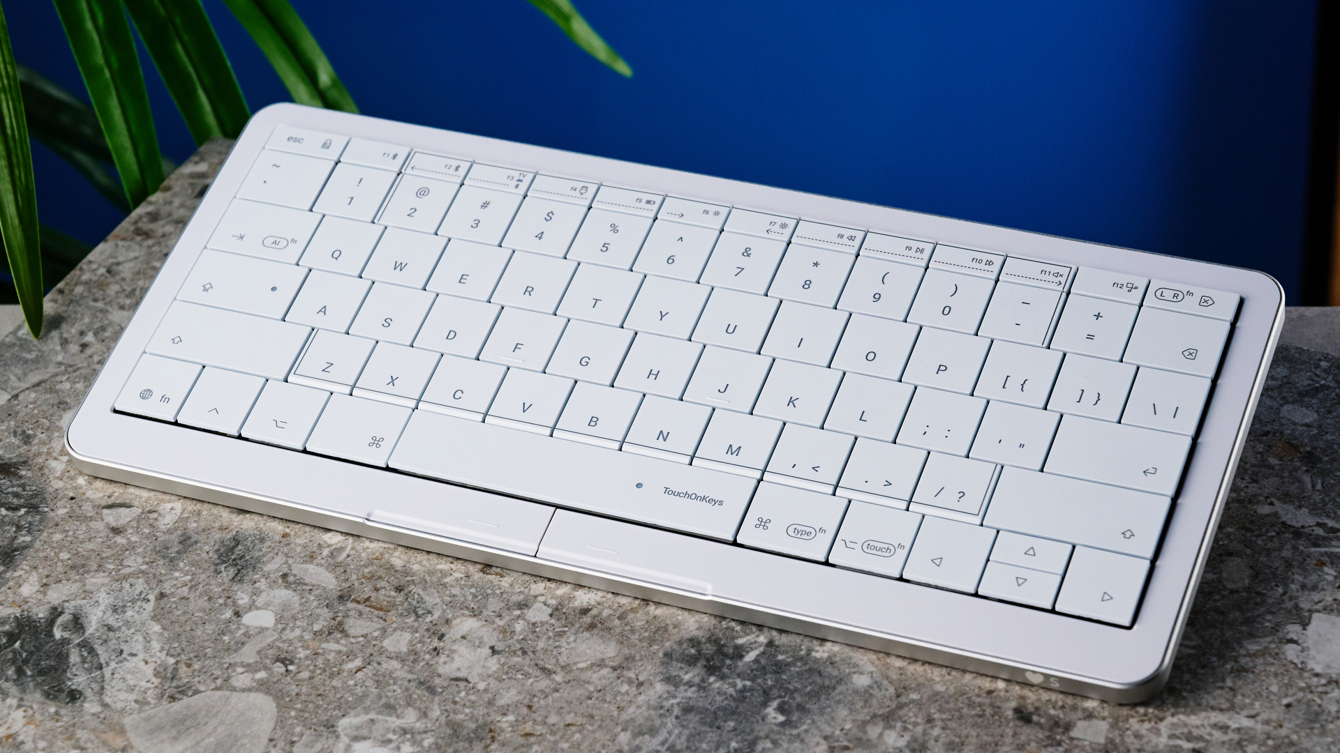 A white Clevetura CLVX S keyboard