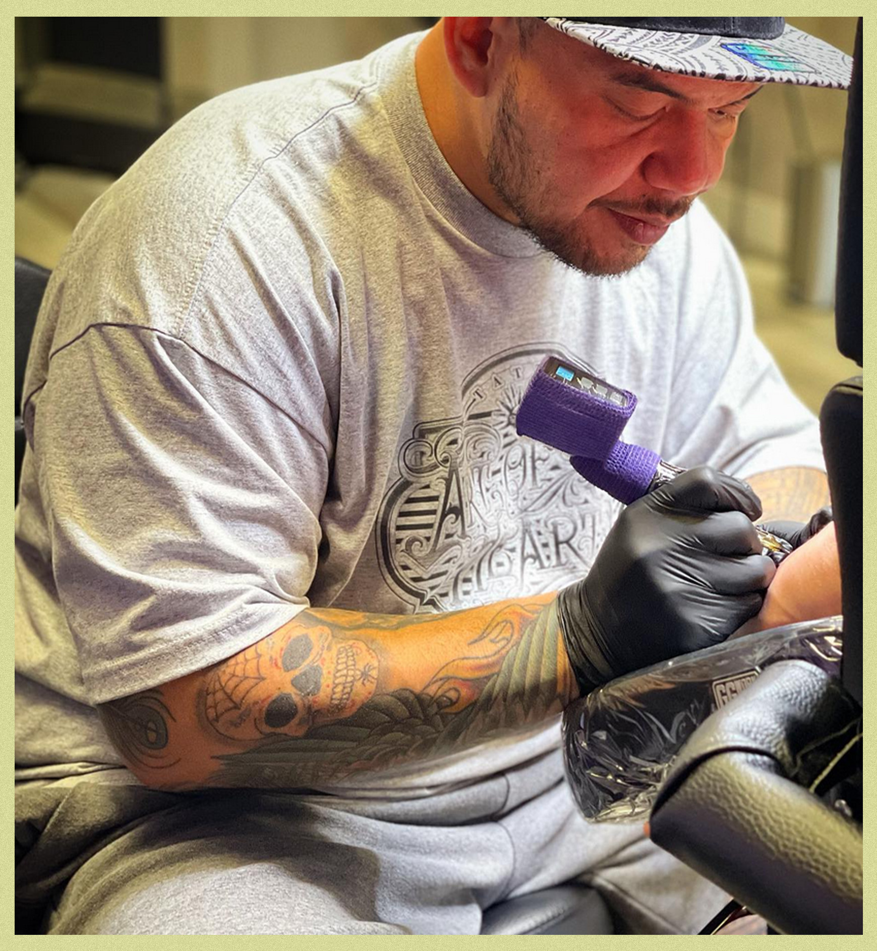 Martin "Phats" Tevega working on a tattoo