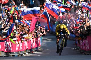 Primoz Roglic on his way to winning stage 20 at the Giro d'Italia surrounded by hundreds of fans at Monte Lussari