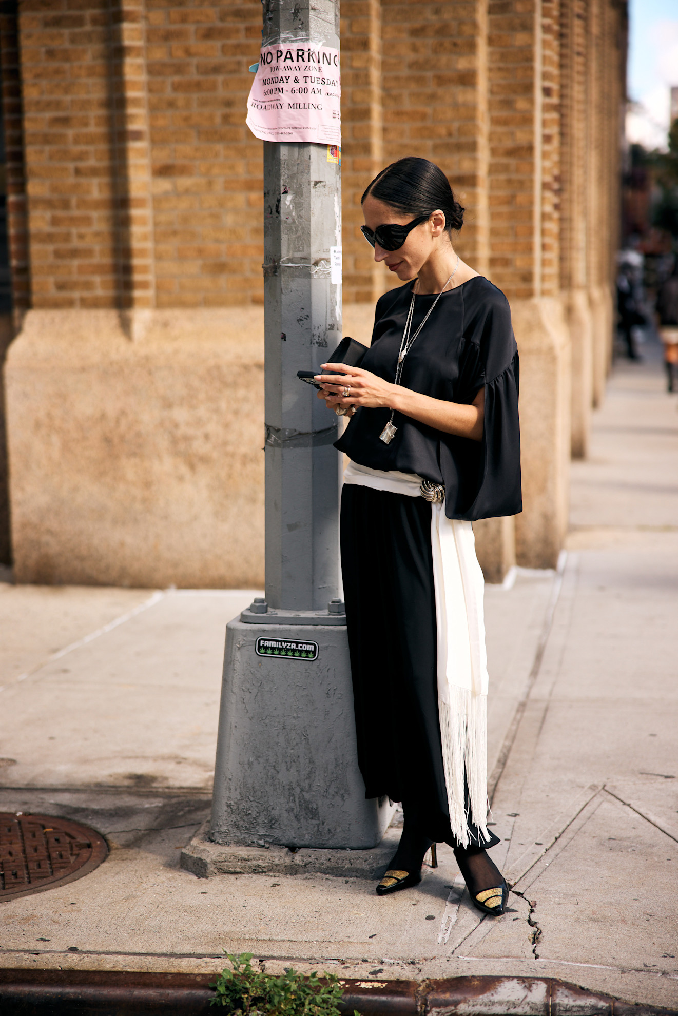 alexis wearing a scarf around the waist at nyfw