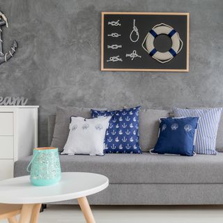 grey sofa with cushions