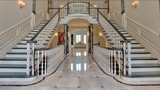 Inside Regina George's 'Mean Girls' Mansion showing a double staircase