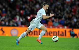 Lucy Bronze playing football for the lionesses