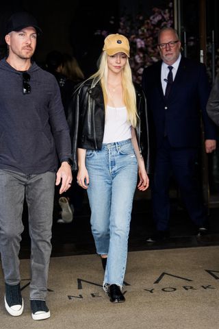 Anya Taylor-Joy pairs Tabi loafers with straight-leg jeans.