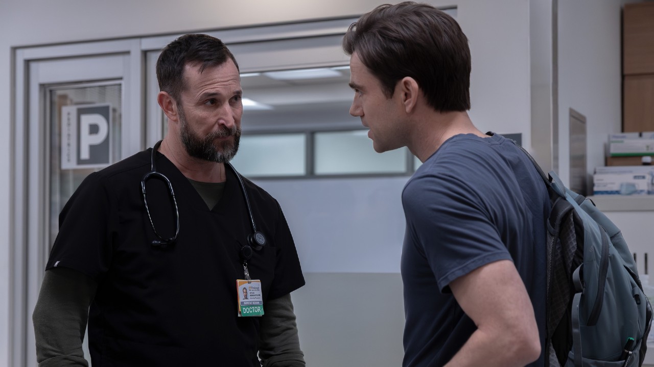 From left to right: Noah Wyle looking at Patrick Ball. 