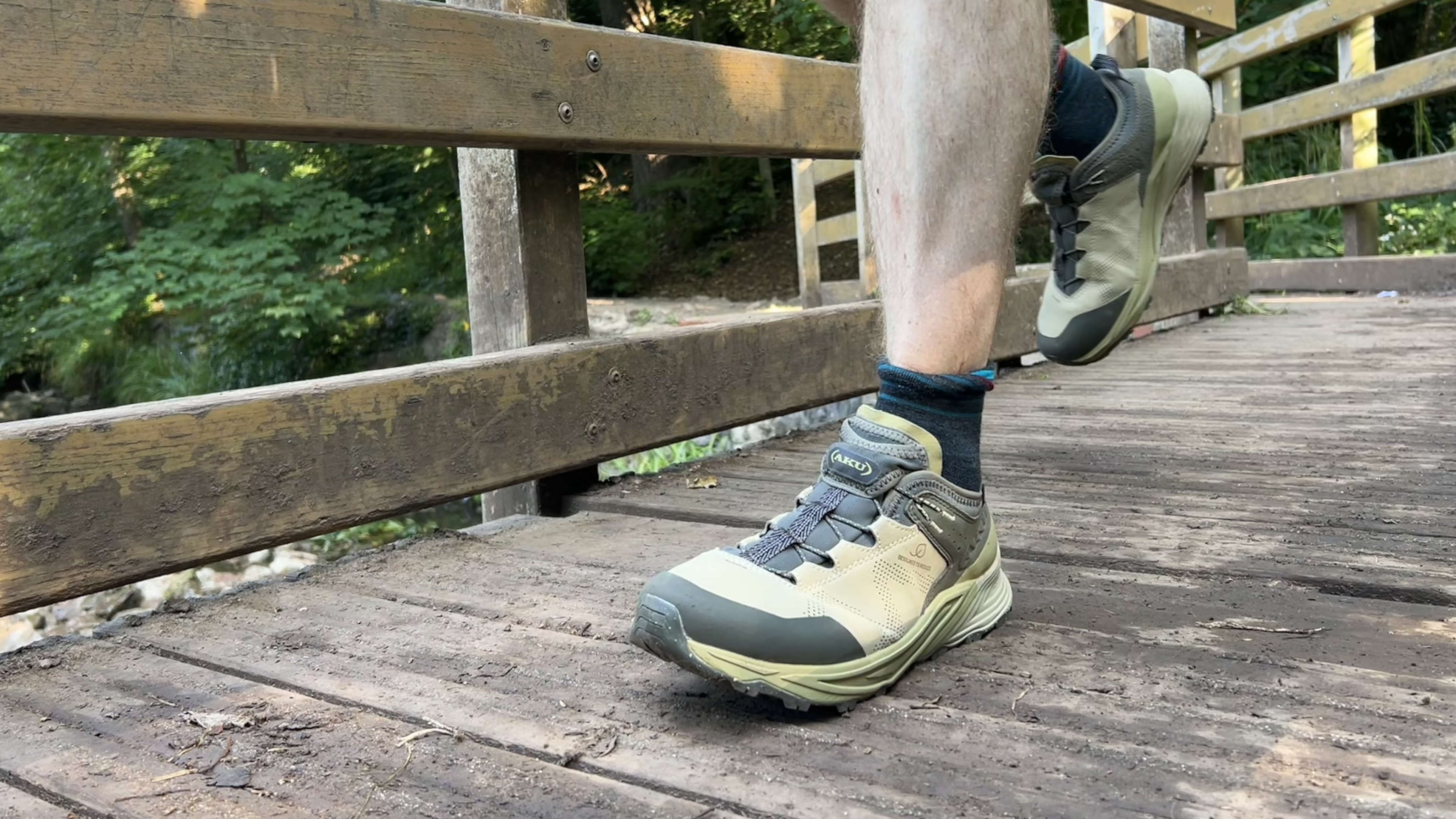 A hiker striding along in the Aku Omnia
