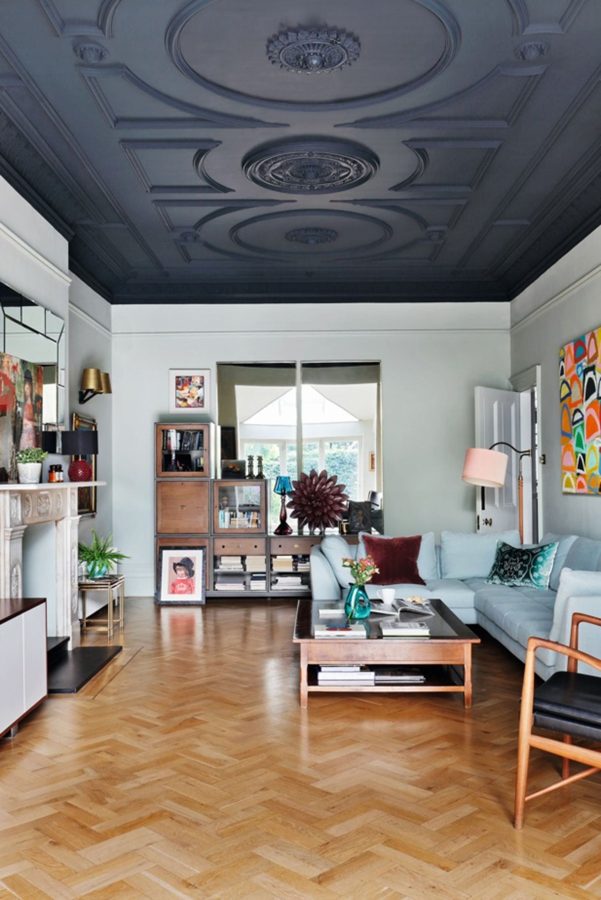 A ceiling painted in dark grey