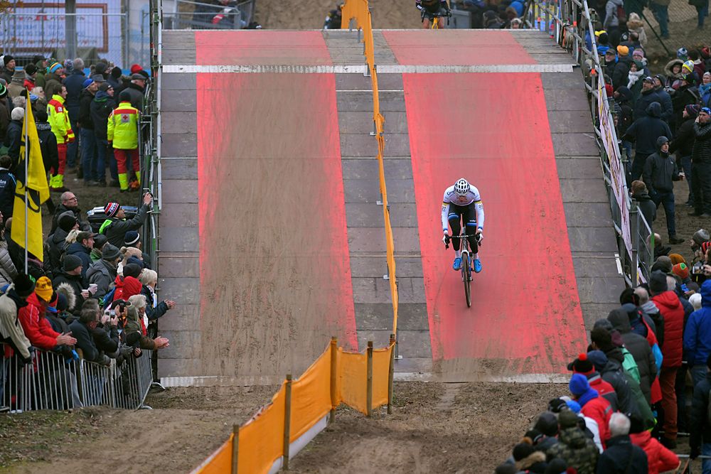 Mathieu van der Poel riding alone ahead of the rest of the field on the Koksijde World Cup course