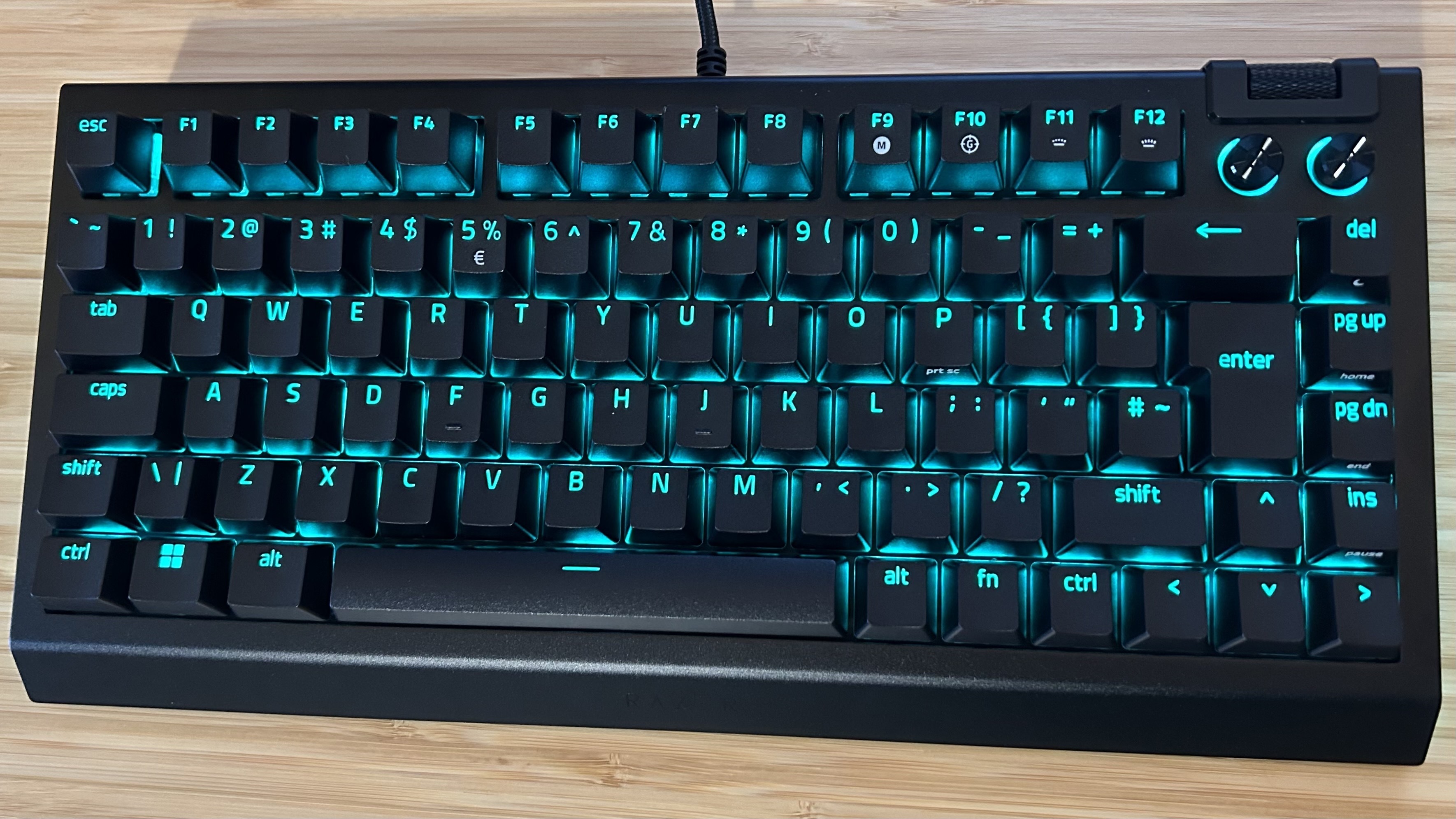 Razer BlackWidow V4 75% keyboard without wrist rest on a wooden table