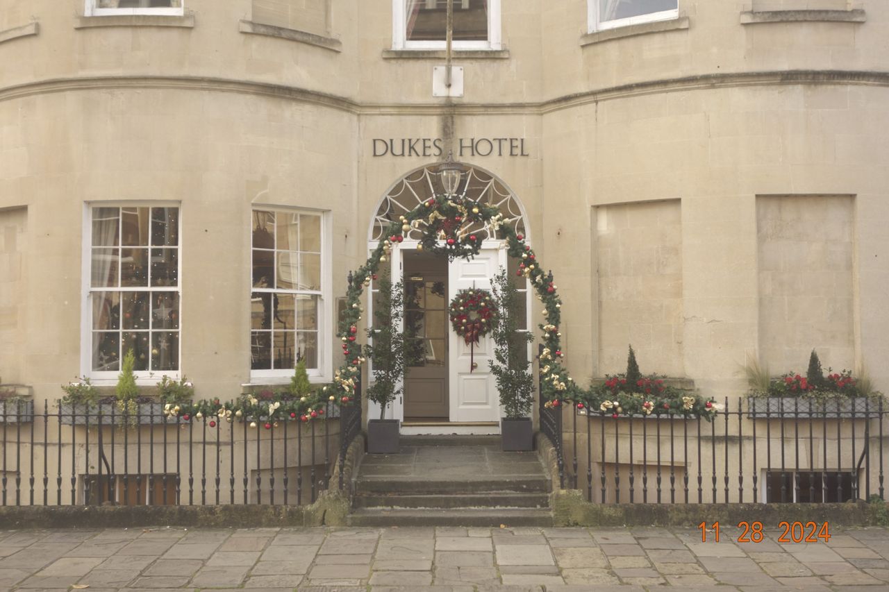 Hotel entrance in the city of Bath, UK, with retro photo picture effect