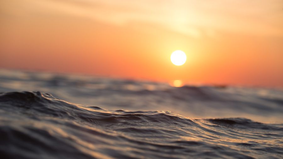 Photo of a sunset sky above the ocean