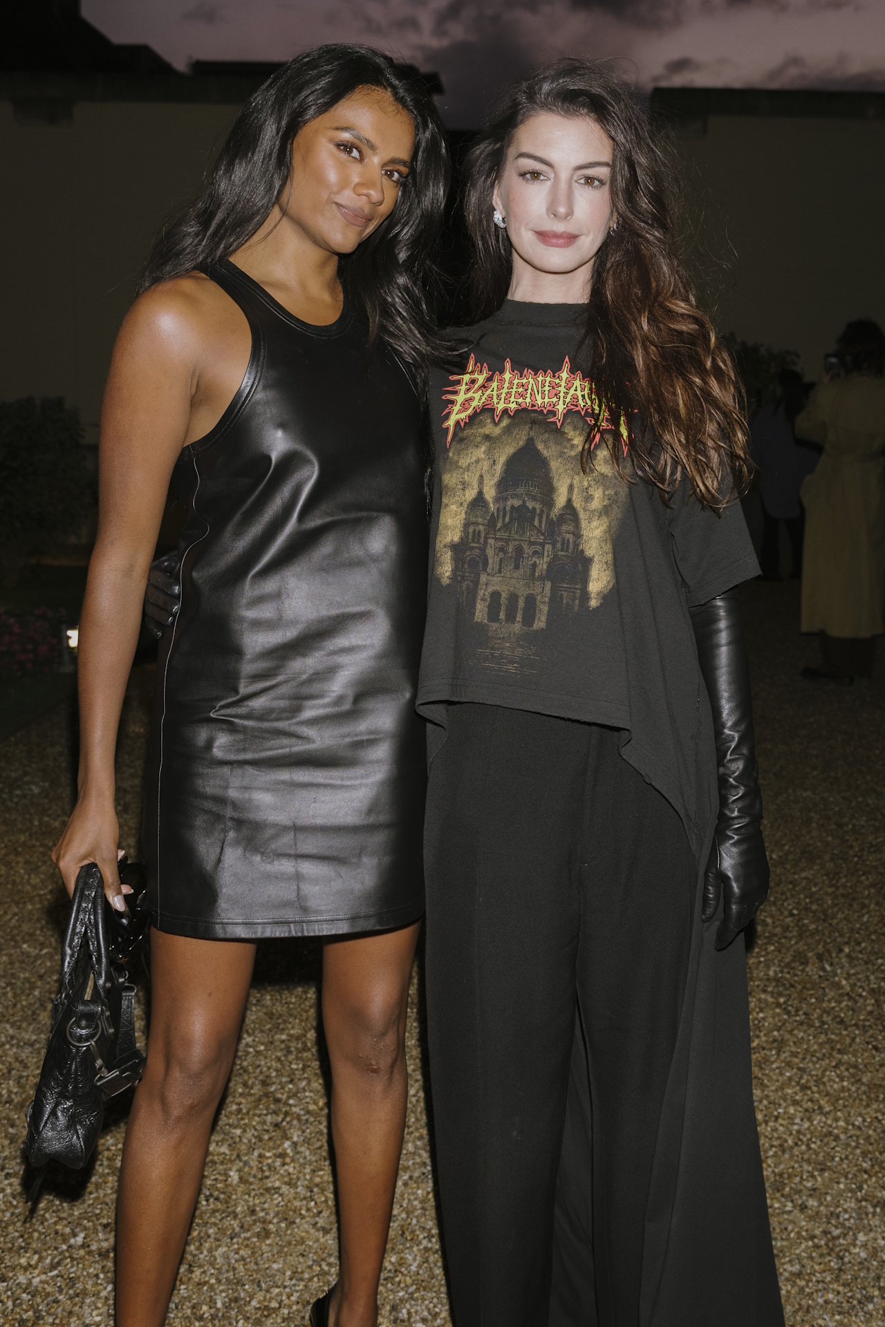 Simone Ashley and Anne Hathaway attend the Balenciaga Womenswear Spring/Summer 2026 show as part of Paris Fashion Week on October 04, 2025 in Paris, France.