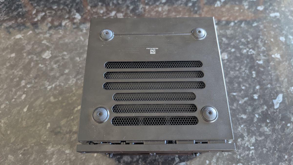 The Valve Steam Machine, pictured on a dark marble worktop.