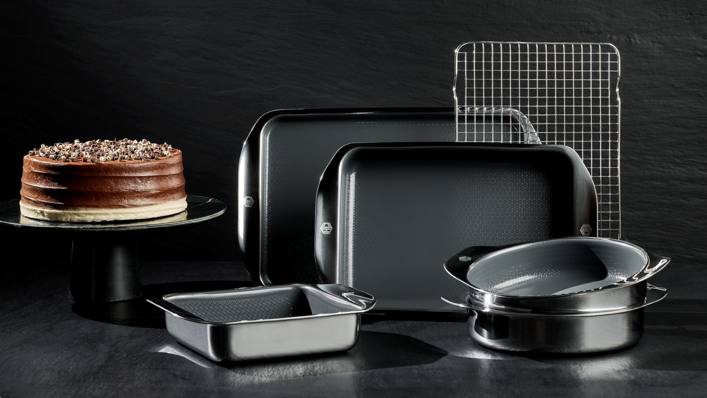 HexClad Hybrid Bakeware collection against a black background