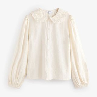 white shirt with puffed sleeves and peter pan collar