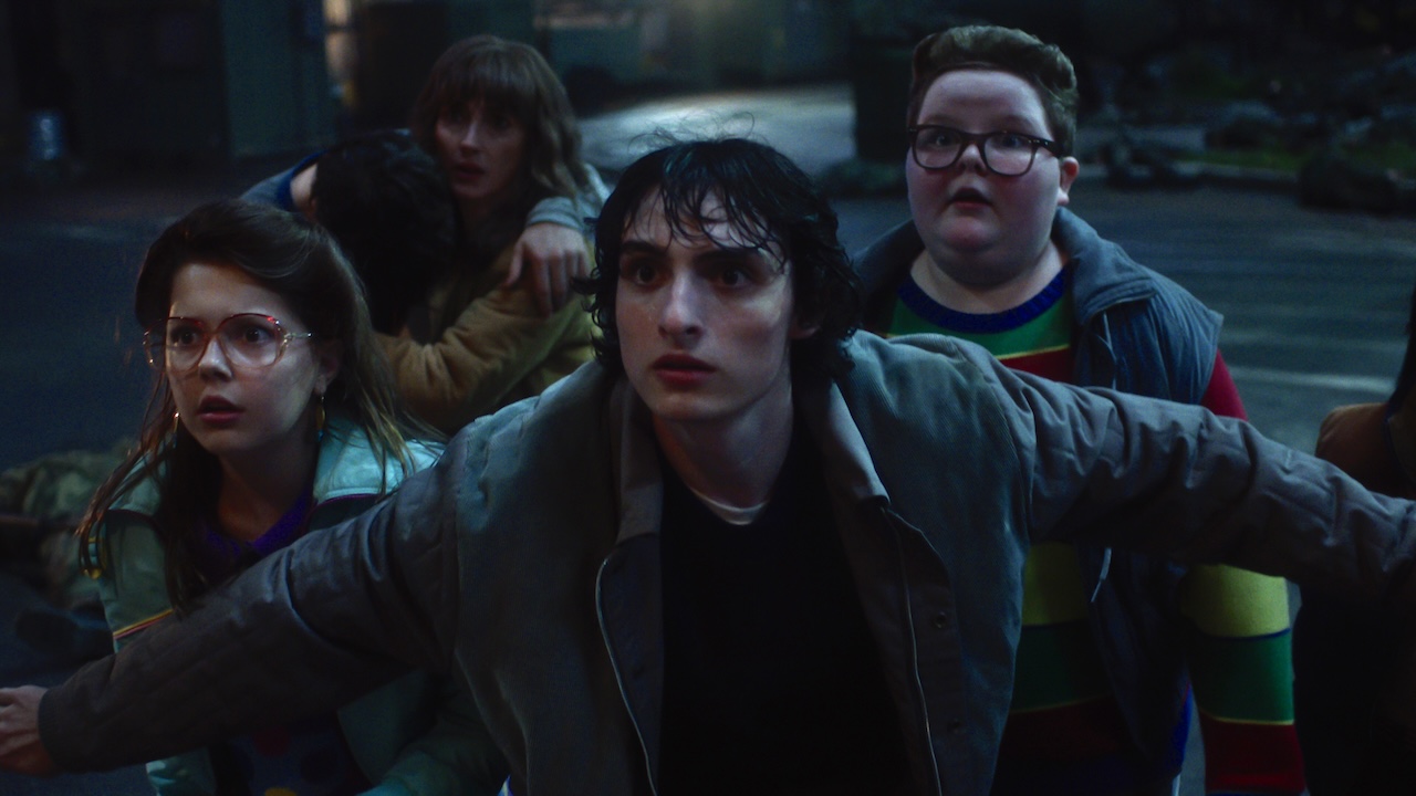 Mike in front of Derek, Joyce and others in Stranger Things Season 5