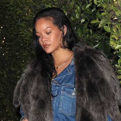 Rihanna wears a Canadian tuxedo and carries a denim Dior bag