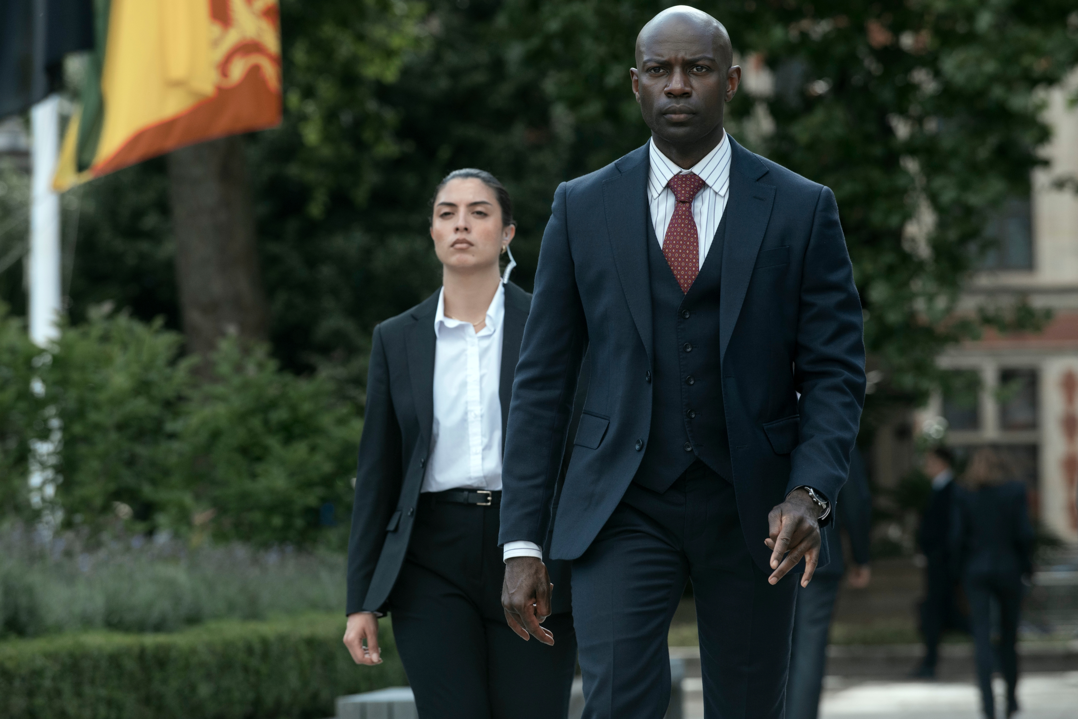 two secret service agents walking together in the diplomat season 3