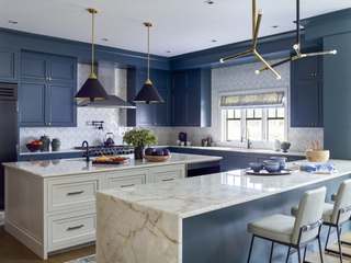 blue and white kitchen with island and breakfast bar