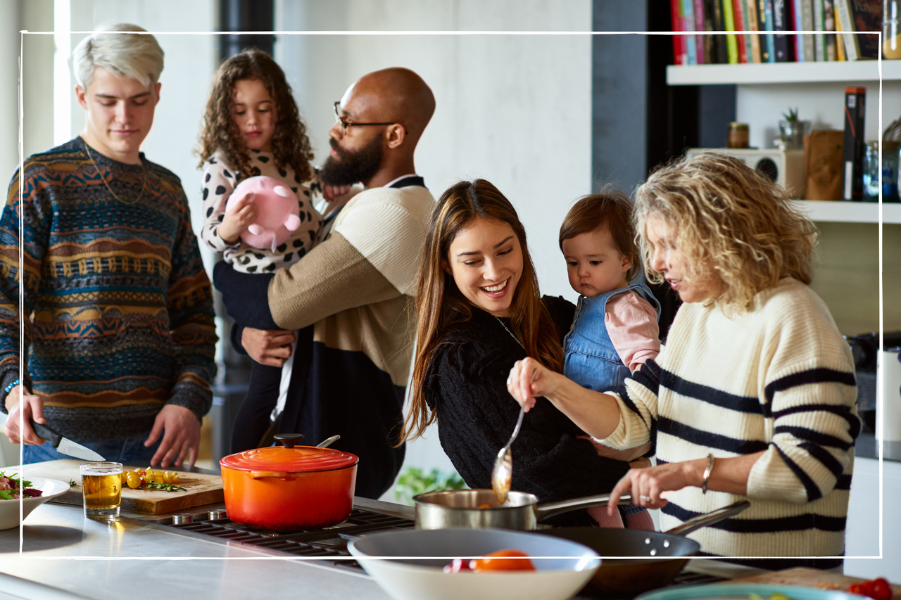 A family of all ages standing in the kitchen, cooking and eating together