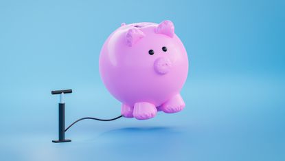 A tire pump appears to be pumping air into a growing piggy bank.