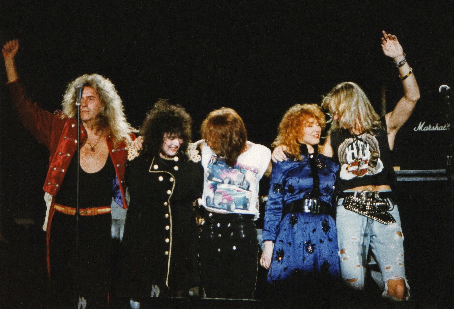 Howard Leese, Ann Wilson, Denny Carmassi, Nancy Wilson and Mark Andes of American rock band Heart take a final bow after their performance on stage at Wembley Arena on May 10th, 1990 in London, England.