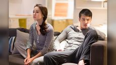Upset couple on couch