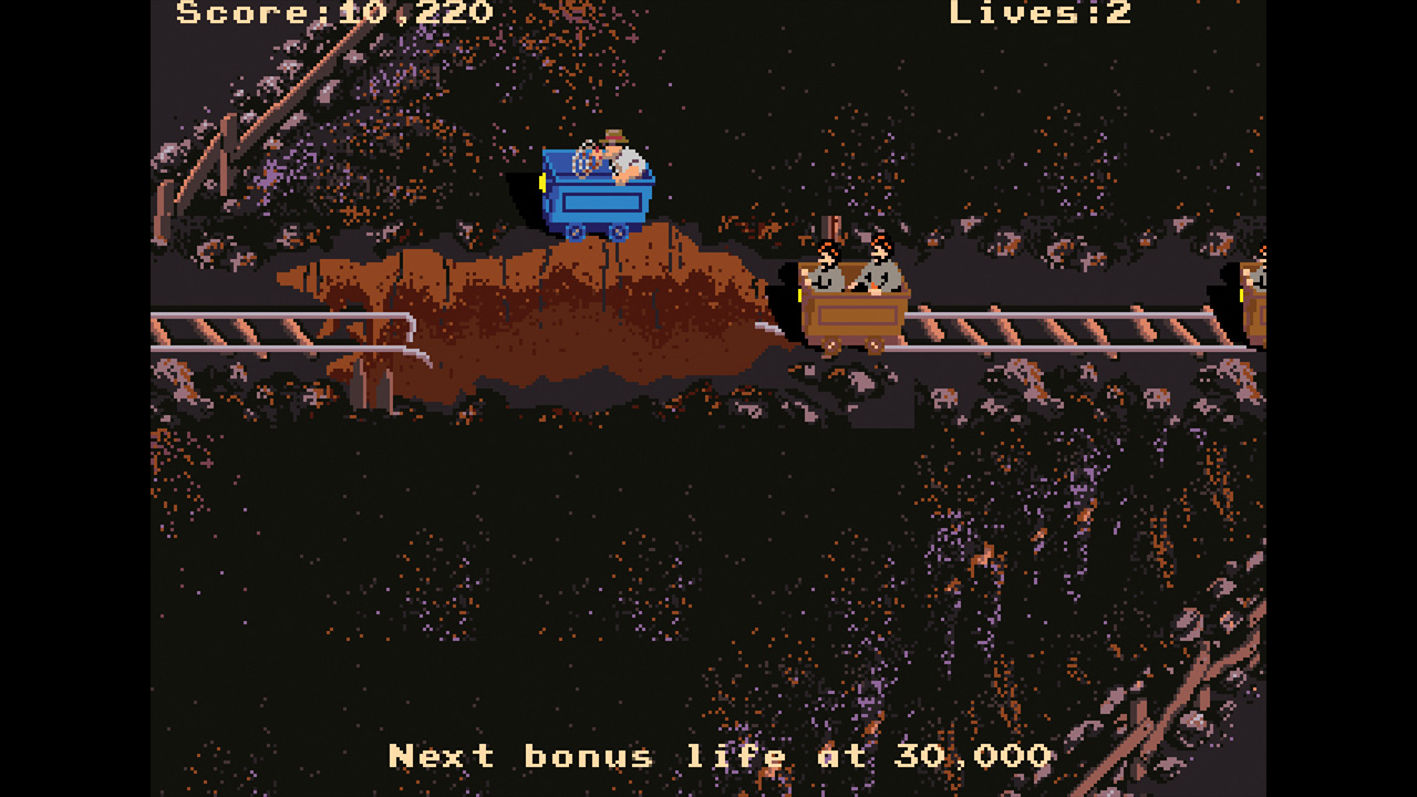 Indy jumps over lava in a mine cart in the arcade Indiana Jones and the Temple of Doom - from Retro Gamer Magazine