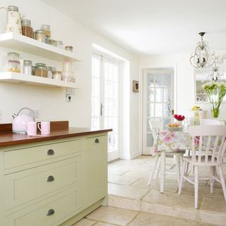 kitchen and dining area with white wall and white table with chair