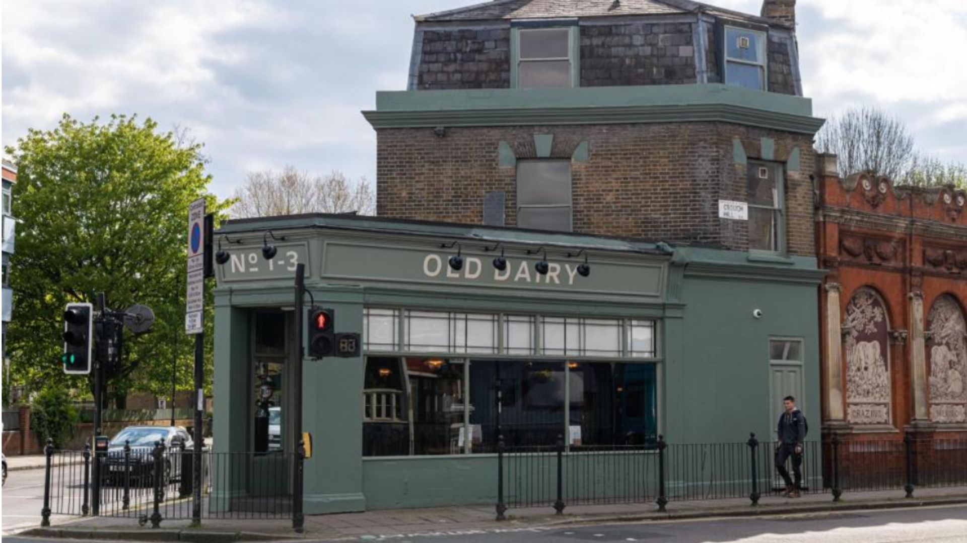 an image of the green painted exterior of the Old Dairy pub in Crouch End formerly owned by Greene King
