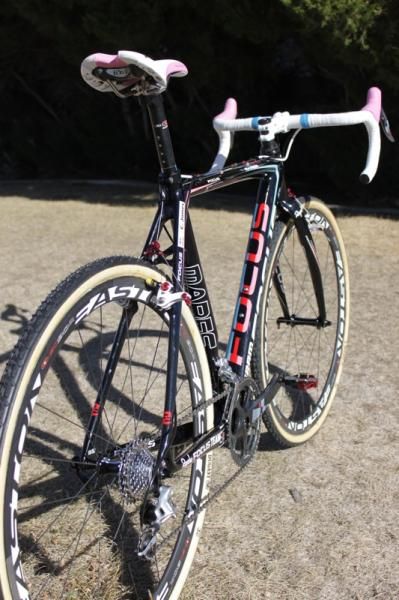 The blue, pink, red and cream colors of the Rapha-Focus team are carried on the bike's down tube logo