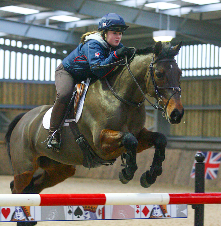 Grace Walker jumping Noble Springbok at home in 2011.