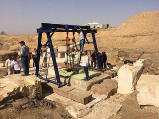 Archaeologists have reached the burial chamber of the 3,800-year-old pyramid discovering the remains of a poorly preserved sarcophagus and a wooden box inscribed with three lines of hieroglyphs. 