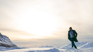 John Luther (Idris Elba) trekking through snow in the Luther movie.