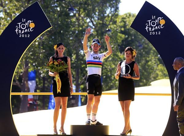 A familiar spot for Mark Cavendish as the Manx Missile celebrates his fourth straight victory in the Tour's final stage.