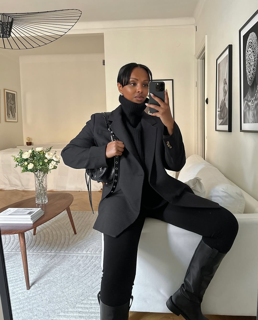 woman wearing black turtleneck outfit fall 2025