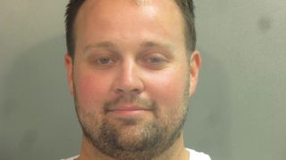 Josh Duggar mugshot child pornography charges arrest.