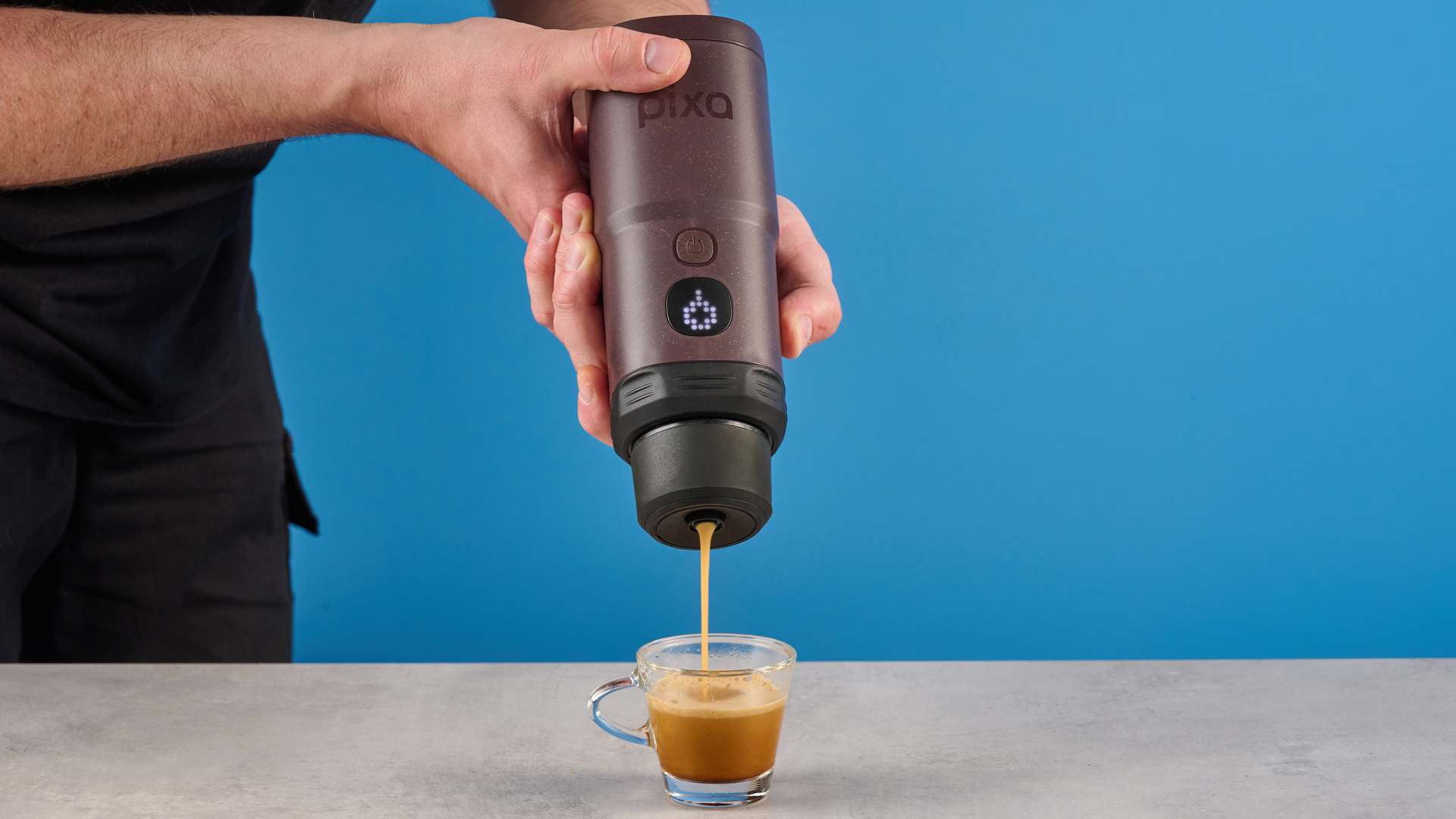 the wacaco pixapresso portable self-heating espresso maker in dark purple color showing usability with nespresso pods and ground coffee, ideal for vacations and camping