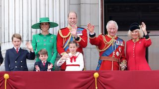 The Royal Family, including Kate Middleton and King Charles, waving on the balcony of Buckingham Palace