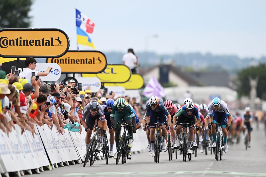 SAINTAMANDMONTROND FRANCE JULY 09 LR Stage winner Jasper Philipsen of Belgium and Team Alpecin Deceuninck Biniam Girmay of Eritrea and Team Intermarche Wanty Green Sprint Jersey Wout Van Aert of Belgium and Team Visma Lease a Bike Sam Bennett of Ireland and Decathlon AG2R La Mondiale Team and Phil Bauhaus of Germany and Team Bahrain Victorious sprint at finish line during the 111th Tour de France 2024 Stage 10 a 1873km stage from Orleans to SaintAmandMontrond UCIWT on July 09 2024 in Orleans France Photo by Tim de WaeleGetty Images